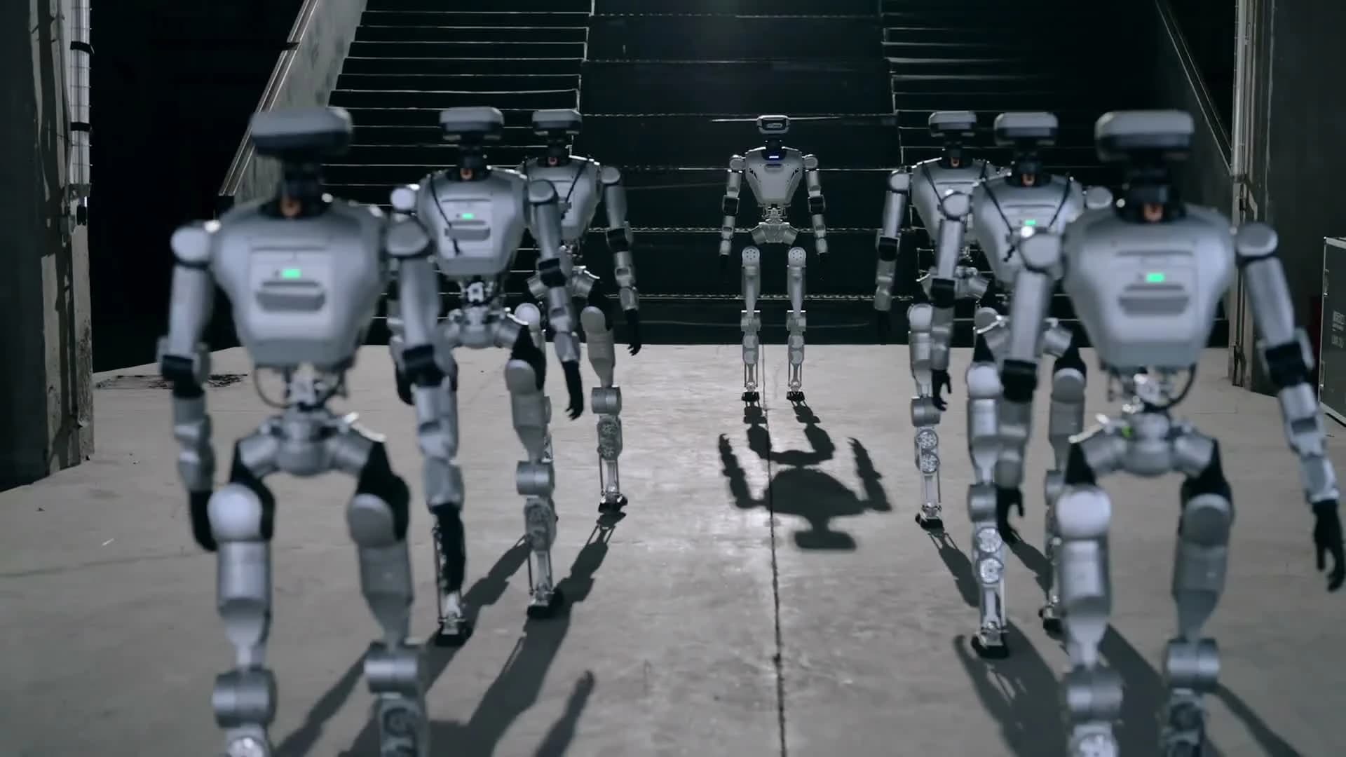 Multiple LimX Oli humanoid robots walking in LimX Dynamics' official product video