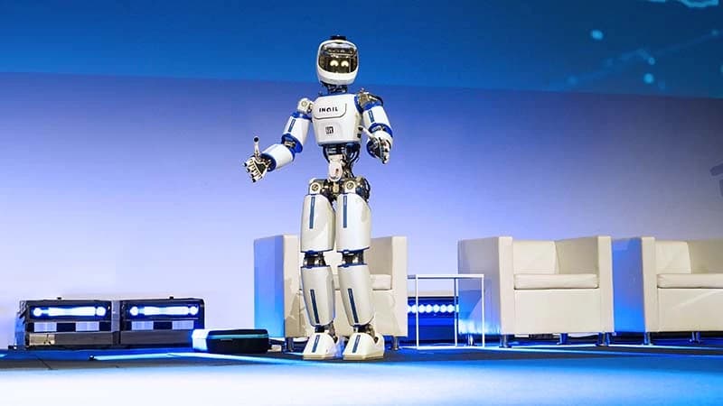 ergoCub standing onstage in an official project photograph